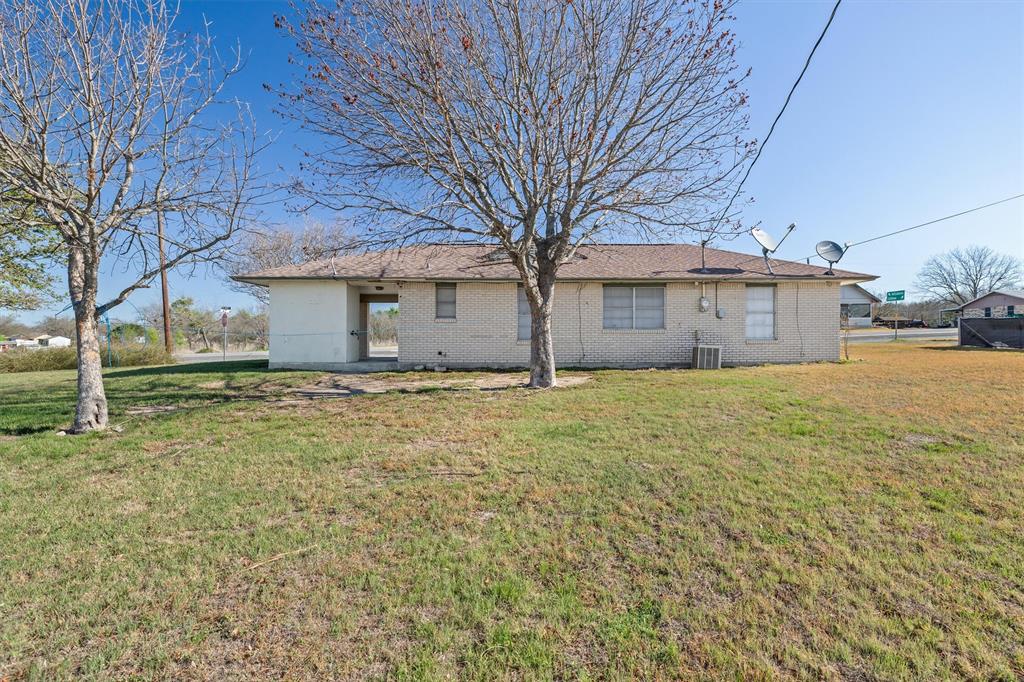 500 Highway 22 Meridian, TX 76665 - Photo 26 of 28 a house with trees in front of it