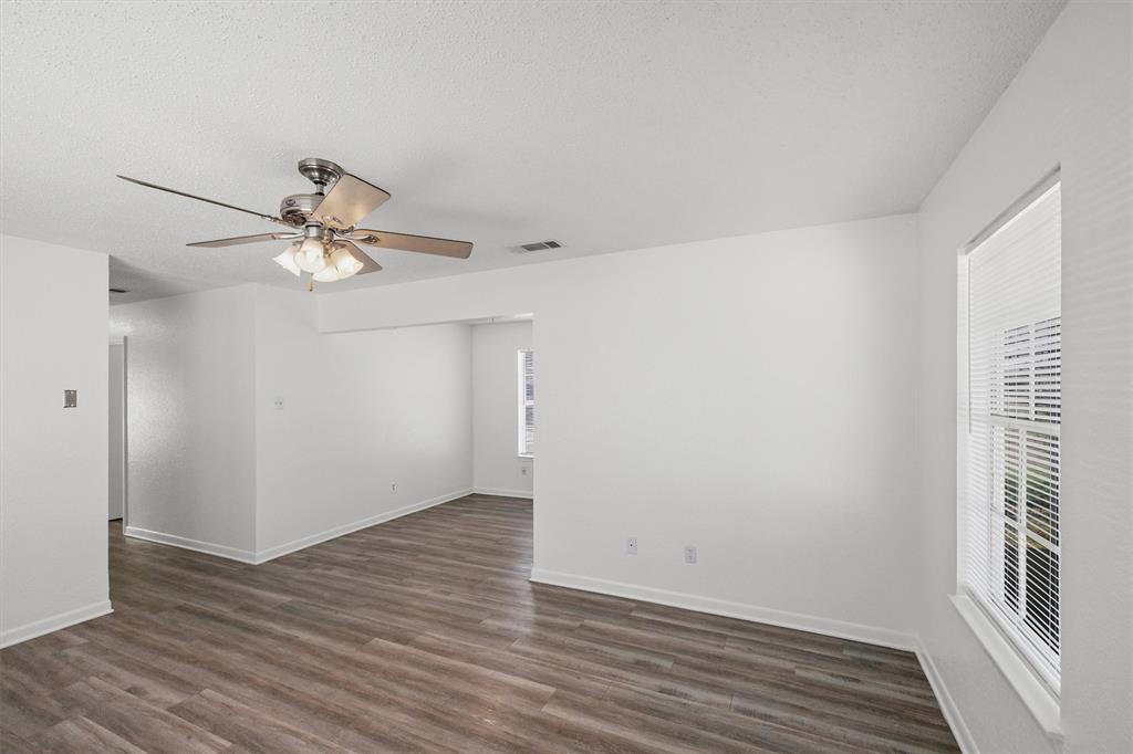 500 Highway 22 Meridian, TX 76665 - Photo 9 of 28 wooden floor in an empty room with a window