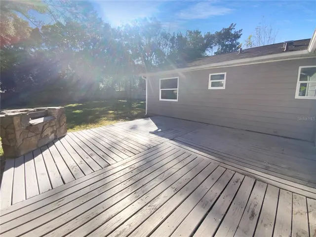 a balcony view with a hardwood floor