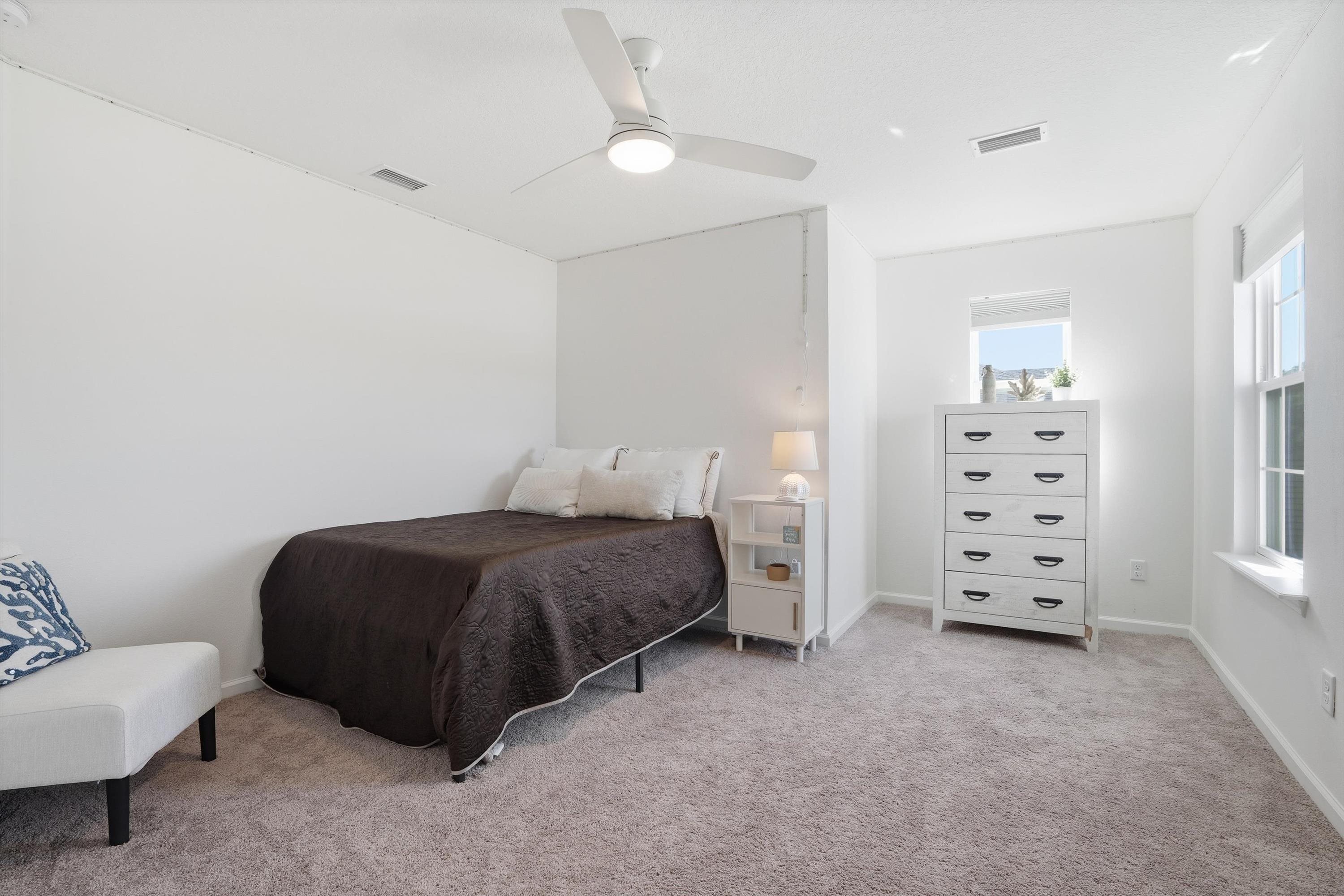 358 Rambling Brk Trail St. Johns, FL 32259 - Photo 21 of 39 a bedroom with a bed and a couch