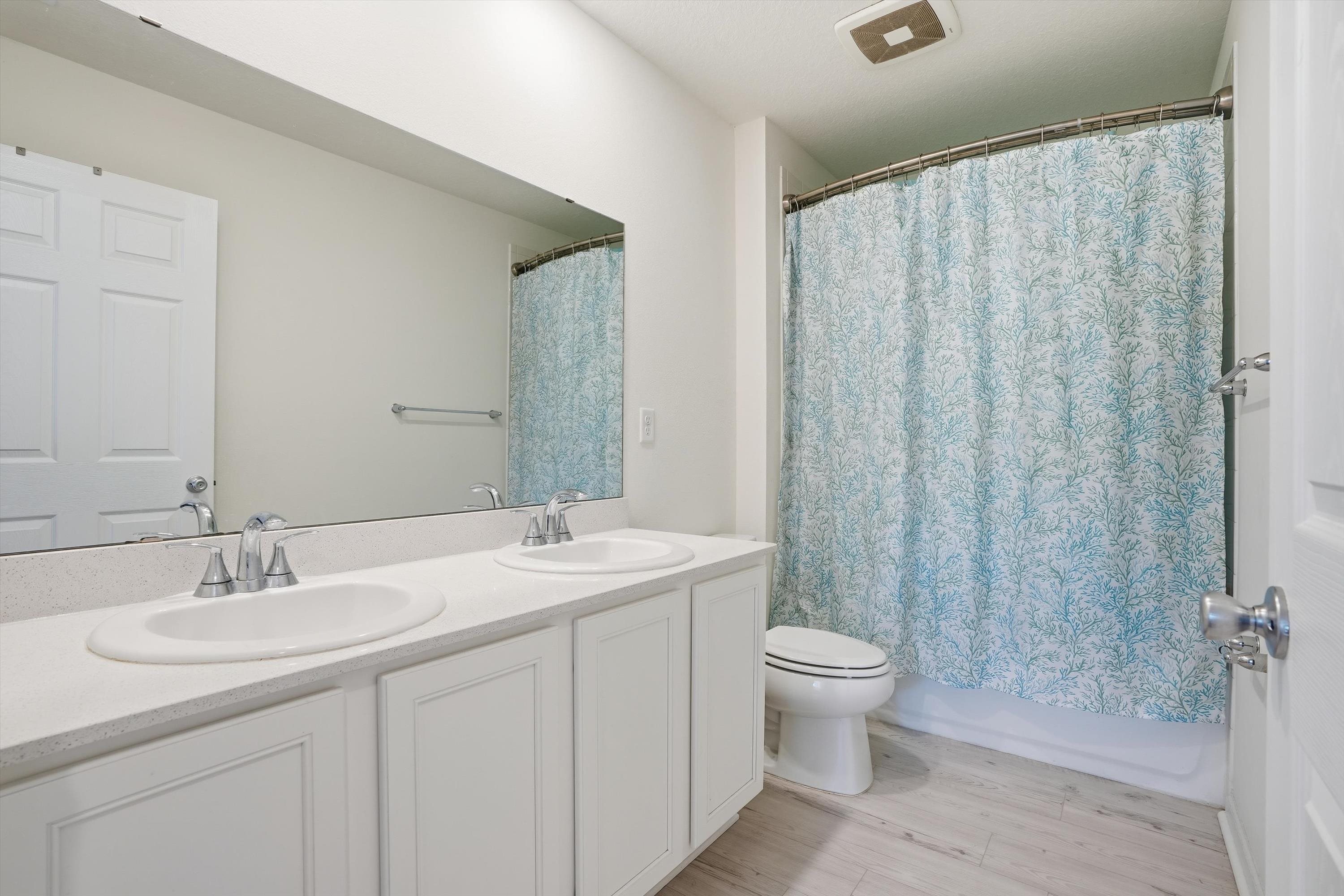 358 Rambling Brk Trail St. Johns, FL 32259 - Photo 22 of 39 a bathroom with a double vanity sink toilet and a mirror