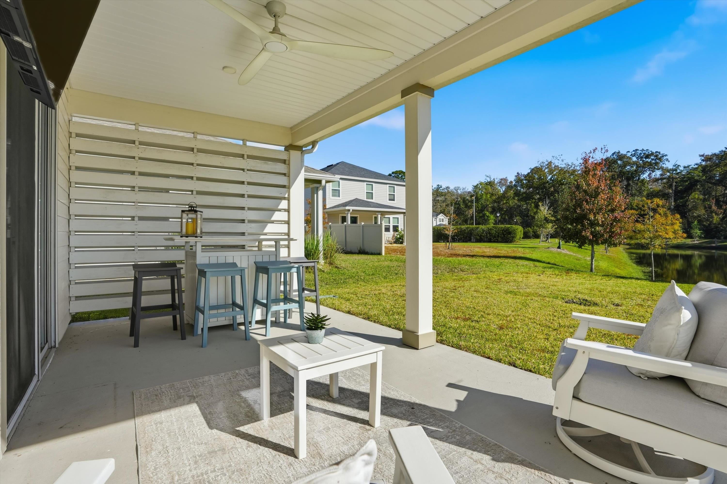 358 Rambling Brk Trail St. Johns, FL 32259 - Photo 25 of 39 a view of a patio with a table and chairs under an umbrella