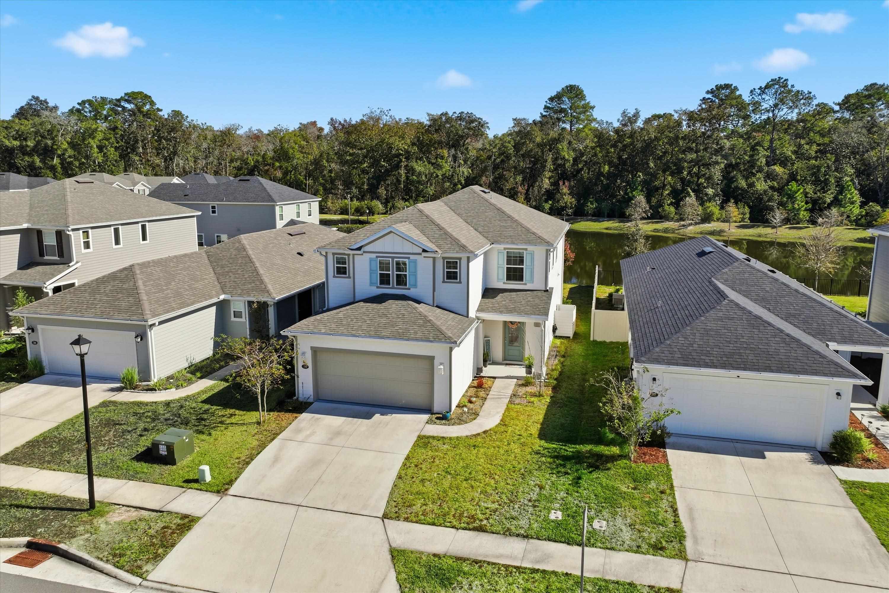 358 Rambling Brk Trail St. Johns, FL 32259 - Photo 30 of 39 a front view of a house with a yard