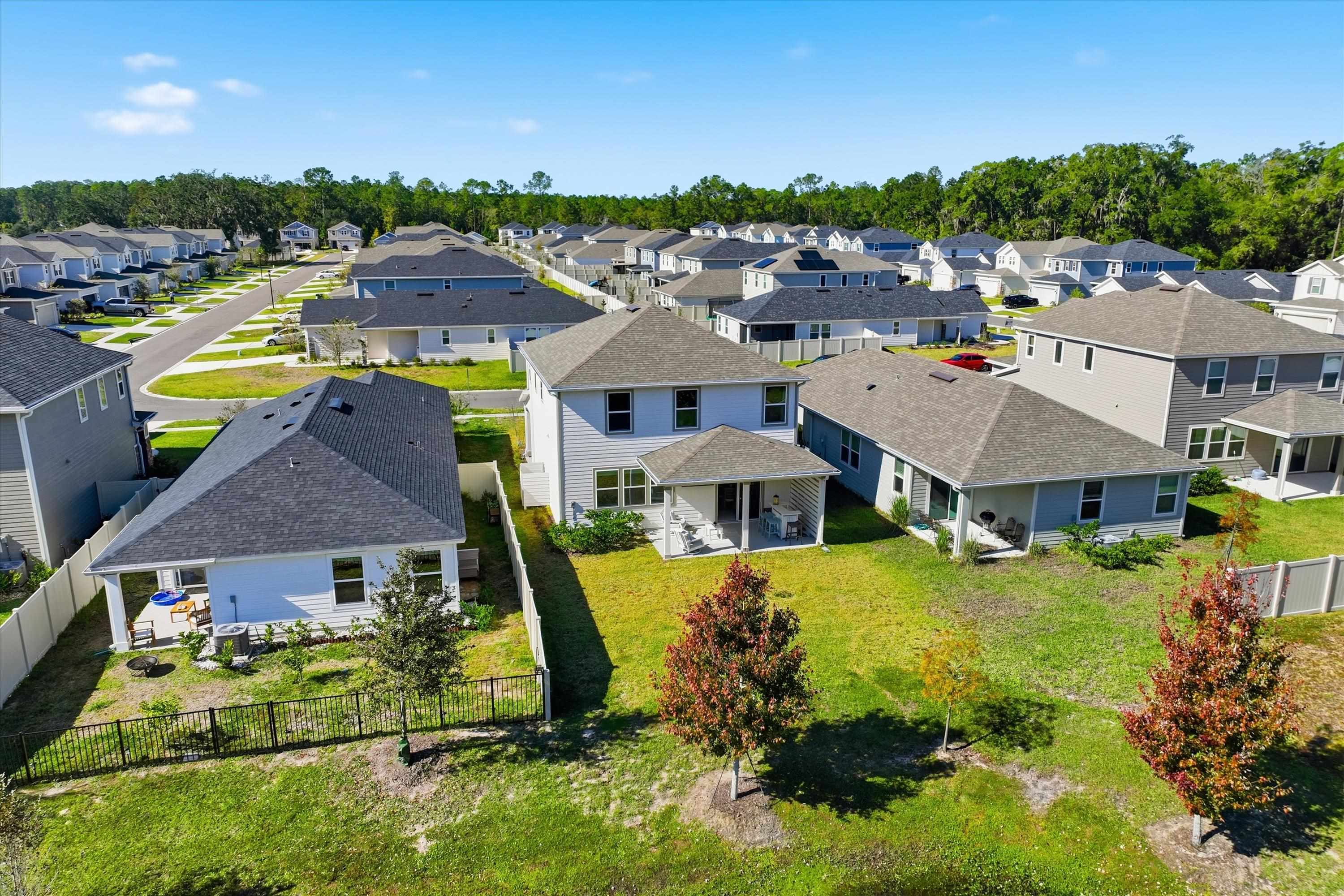 358 Rambling Brk Trail St. Johns, FL 32259 - Photo 31 of 39 an aerial view of a house with swimming pool and large trees