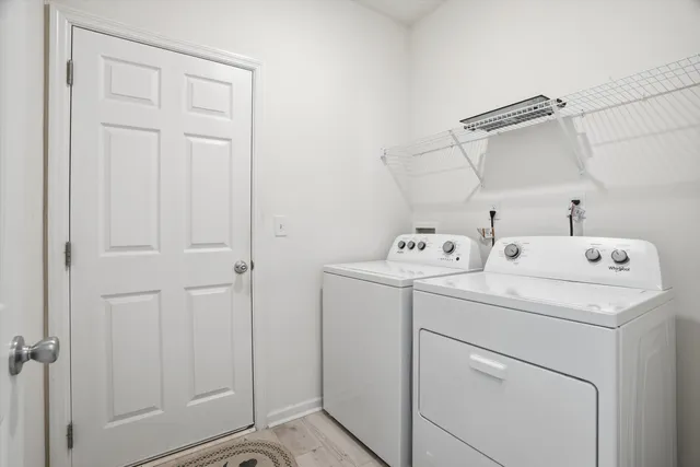 a utility room with dryer and washer