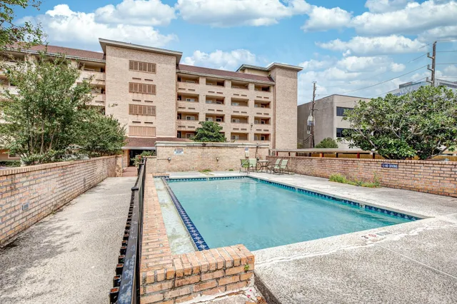 a view of a swimming pool with a lounge chairs