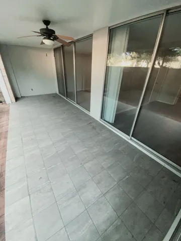 a view of an empty room with a fireplace