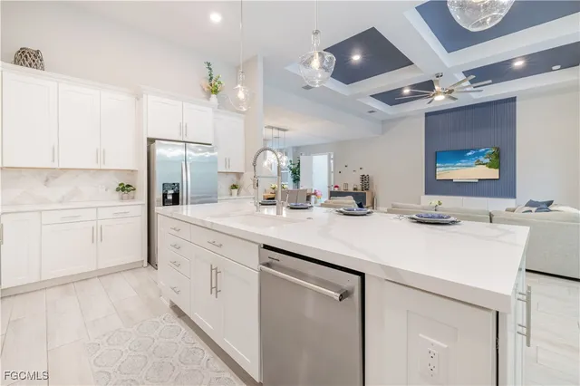 a kitchen with a sink and a stove top oven