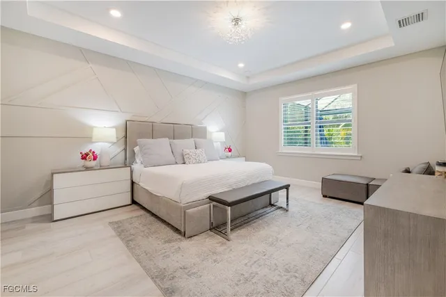 a bedroom with a bed and a table