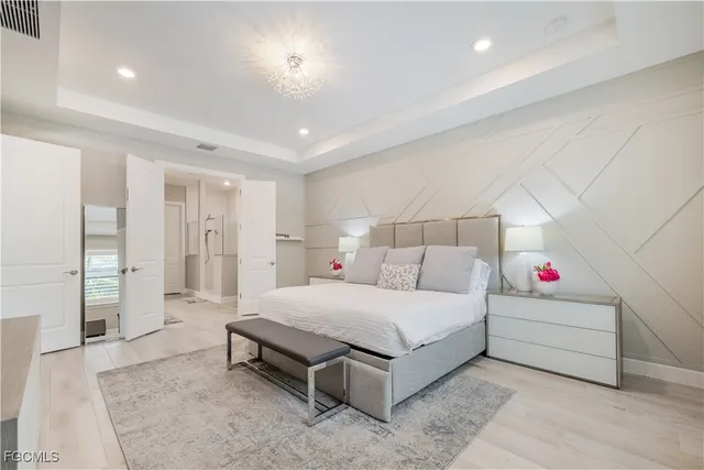 a spacious bathroom with a double vanity sink mirror and shower