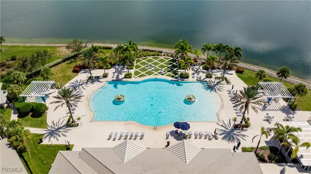 an aerial view of a house with a lake view