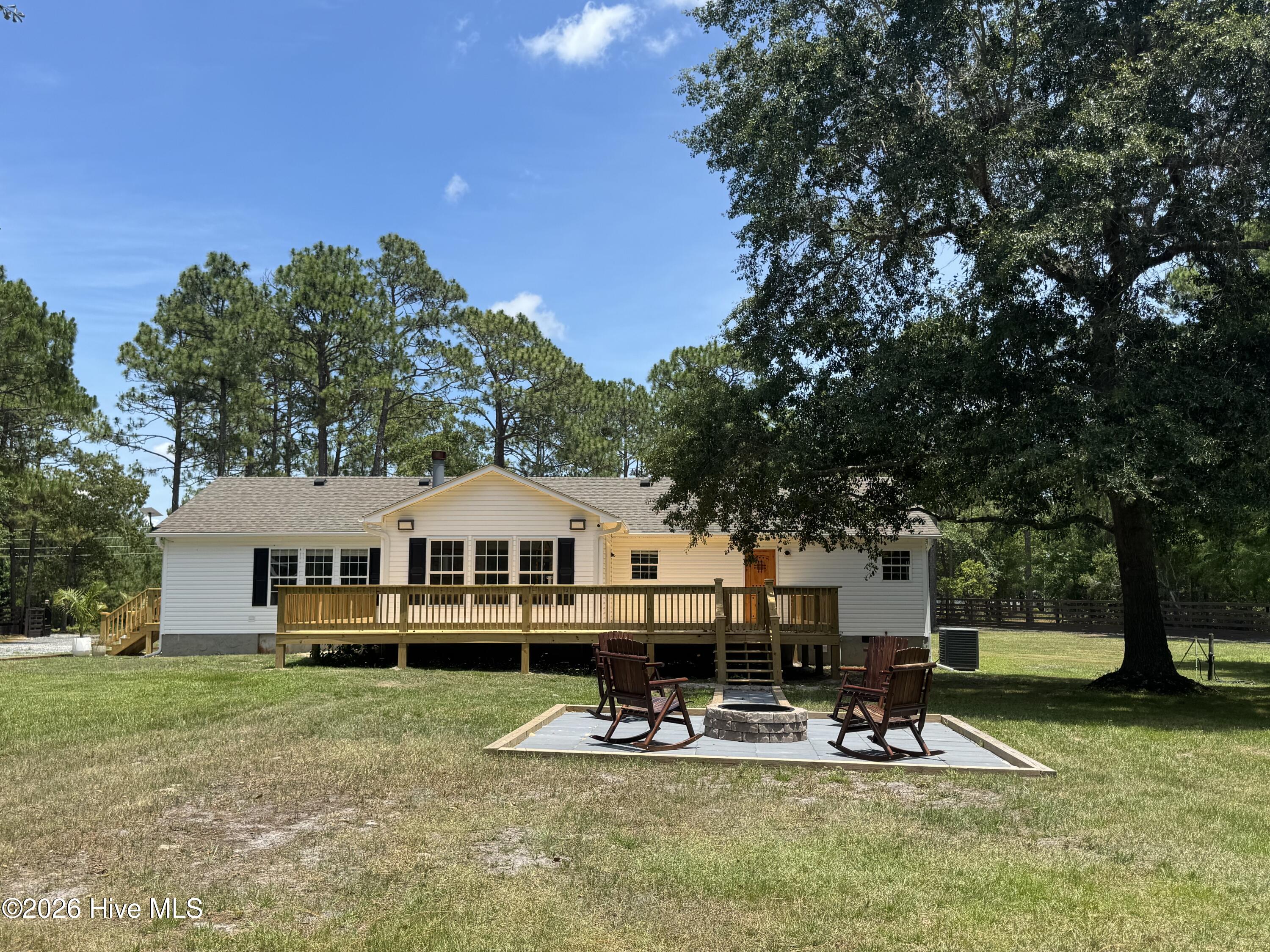 1265 Gilbert Road Southeast Bolivia, NC 28422 - Photo 4 of 46 Enjoy watching your horses or children play from your back deck