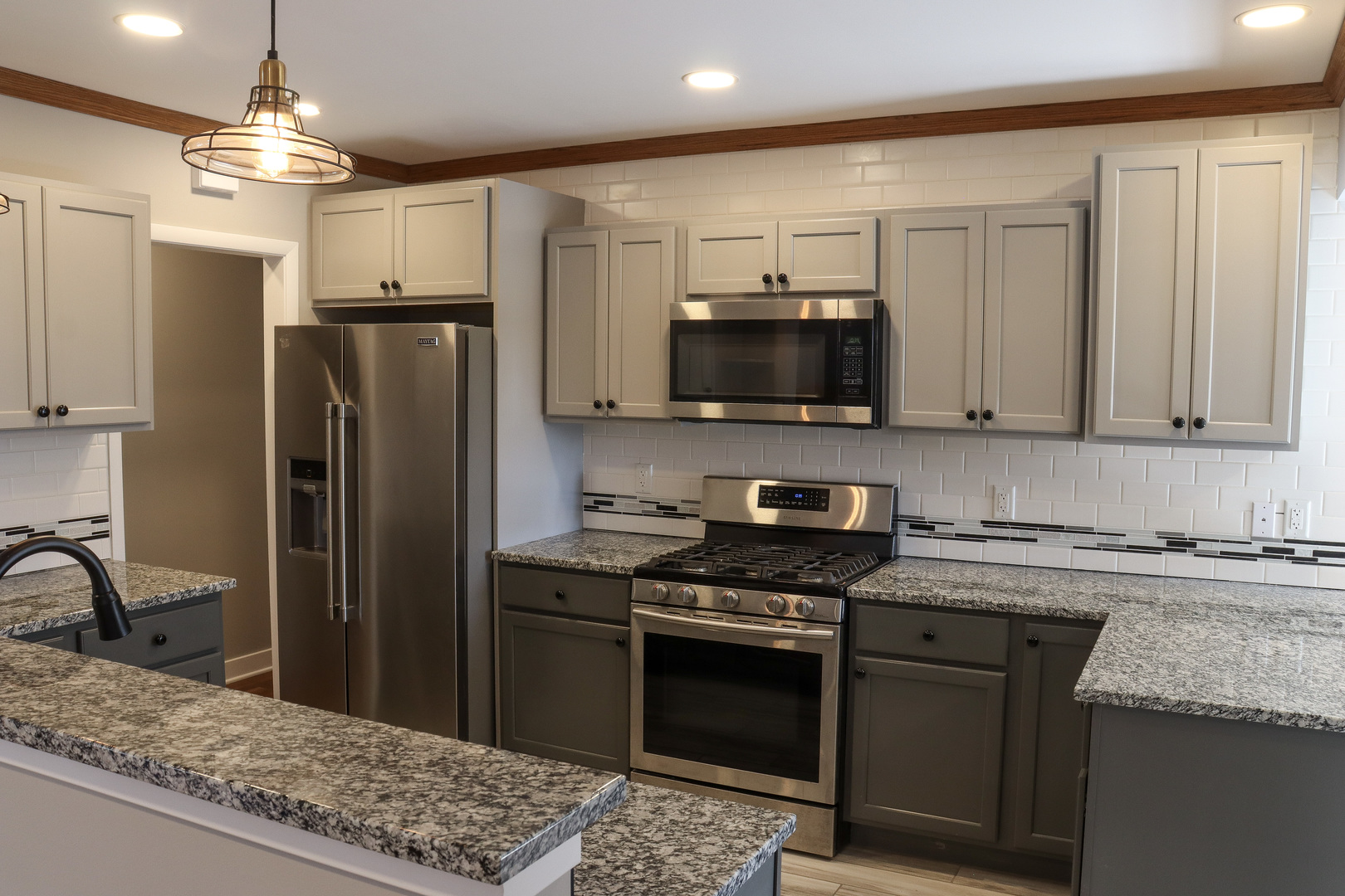 15875 Timberlane Morrison, IL 61270 - Photo 12 of 33 a kitchen with stainless steel appliances granite countertop a refrigerator a stove a sink and a microwave