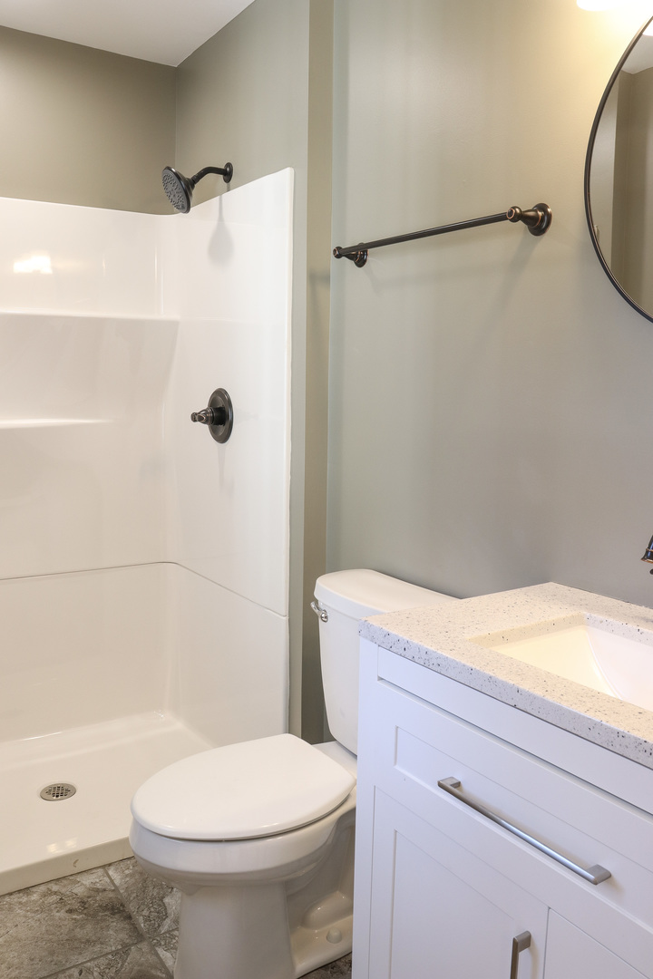 15875 Timberlane Morrison, IL 61270 - Photo 22 of 33 a bathroom with a toilet and a shower