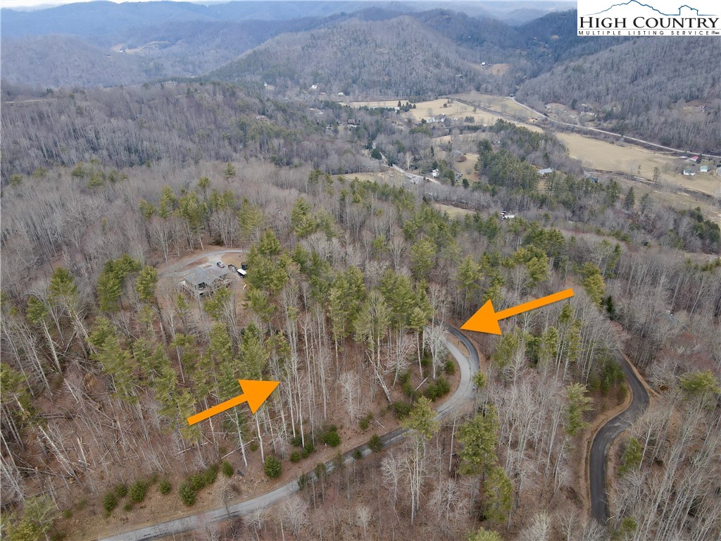 Mantera Ridge Sugar Grove, NC 28679 - Photo 15 of 16 an aerial view of a house with a yard and a lake view