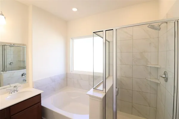 a bathroom with a bathtub and a sink