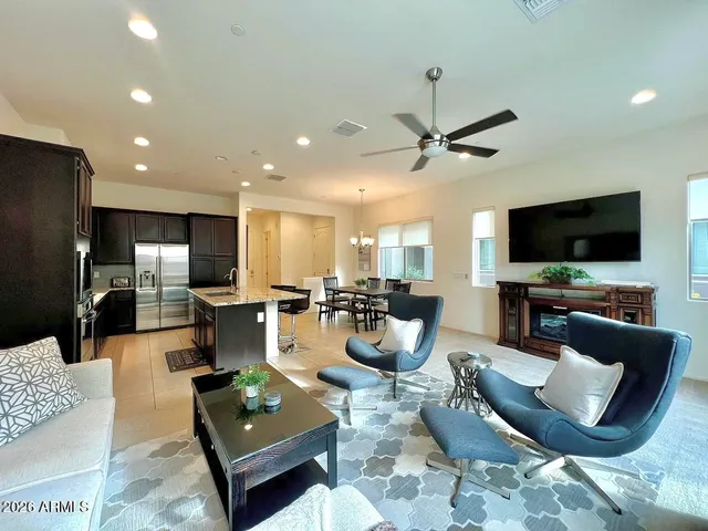 a bathroom with a sink mirror and toilet