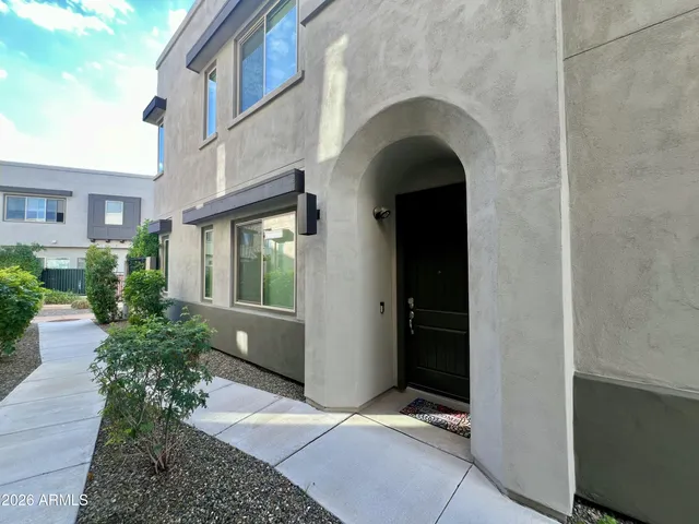 a bathroom with a double vanity sink toilet and a mirror