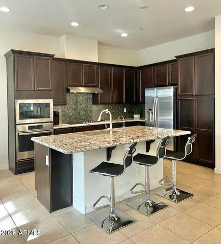 a view of roof deck with seating space and city view