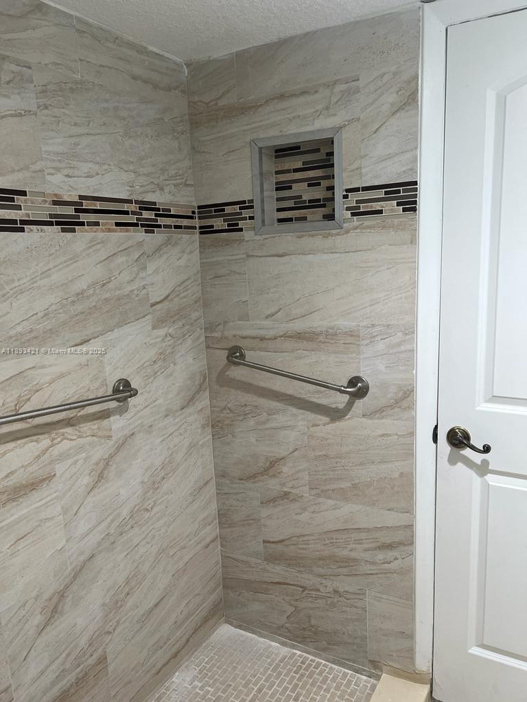 2670 West 76th Street, Unit 101 Hialeah, FL 33016 - Photo 18 of 35 a bathroom with a shower