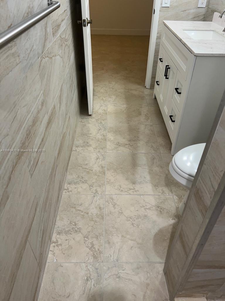 2670 West 76th Street, Unit 101 Hialeah, FL 33016 - Photo 21 of 35 a bathroom with a sink and a mirror