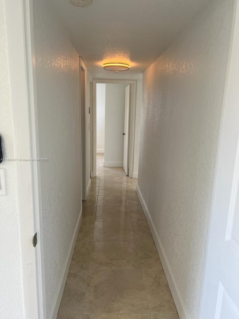 2670 West 76th Street, Unit 101 Hialeah, FL 33016 - Photo 24 of 35 a view of a hallway