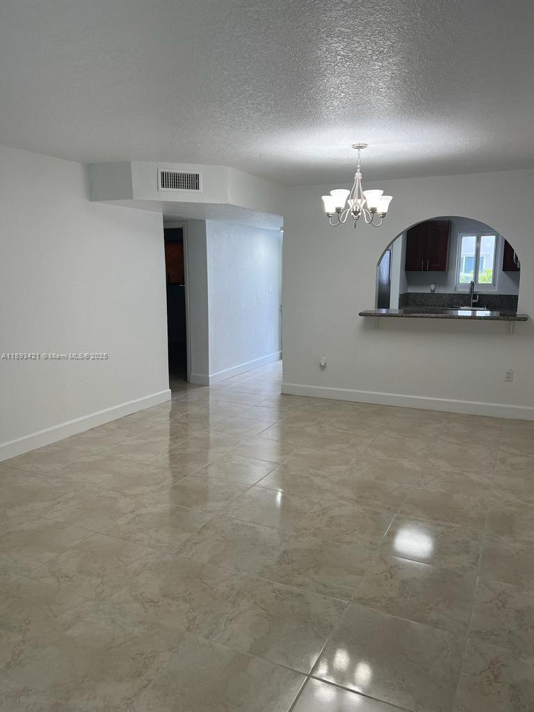 2670 West 76th Street, Unit 101 Hialeah, FL 33016 - Photo 4 of 35 a view of a livingroom with furniture