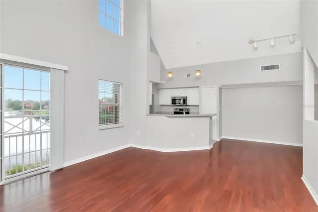 a view of an empty room with windows