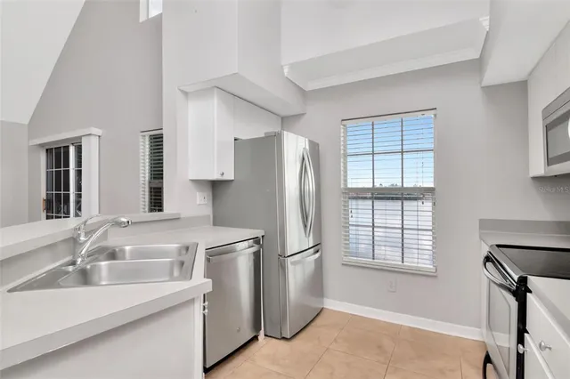 a view of storage and utility room with washer and dryer