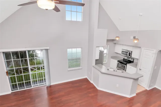 a bathroom with a bathtub shower sink vanity granite and a shower