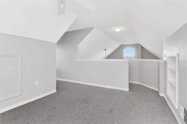 a view of a lake with houses in the back