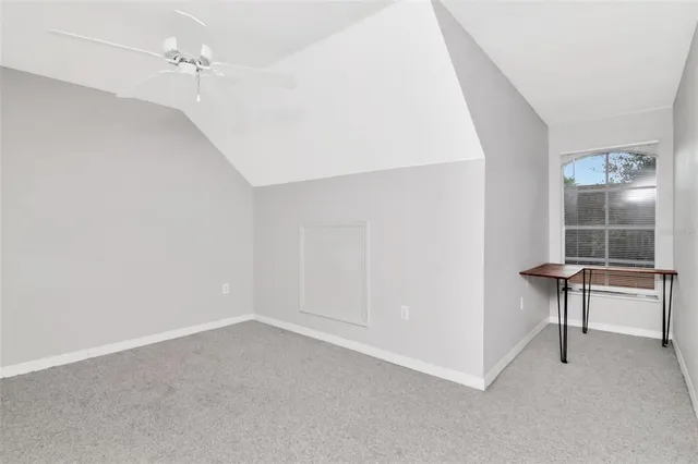 a view of a lake with a house in the background