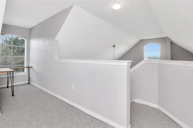 a view of a lake with houses in the back