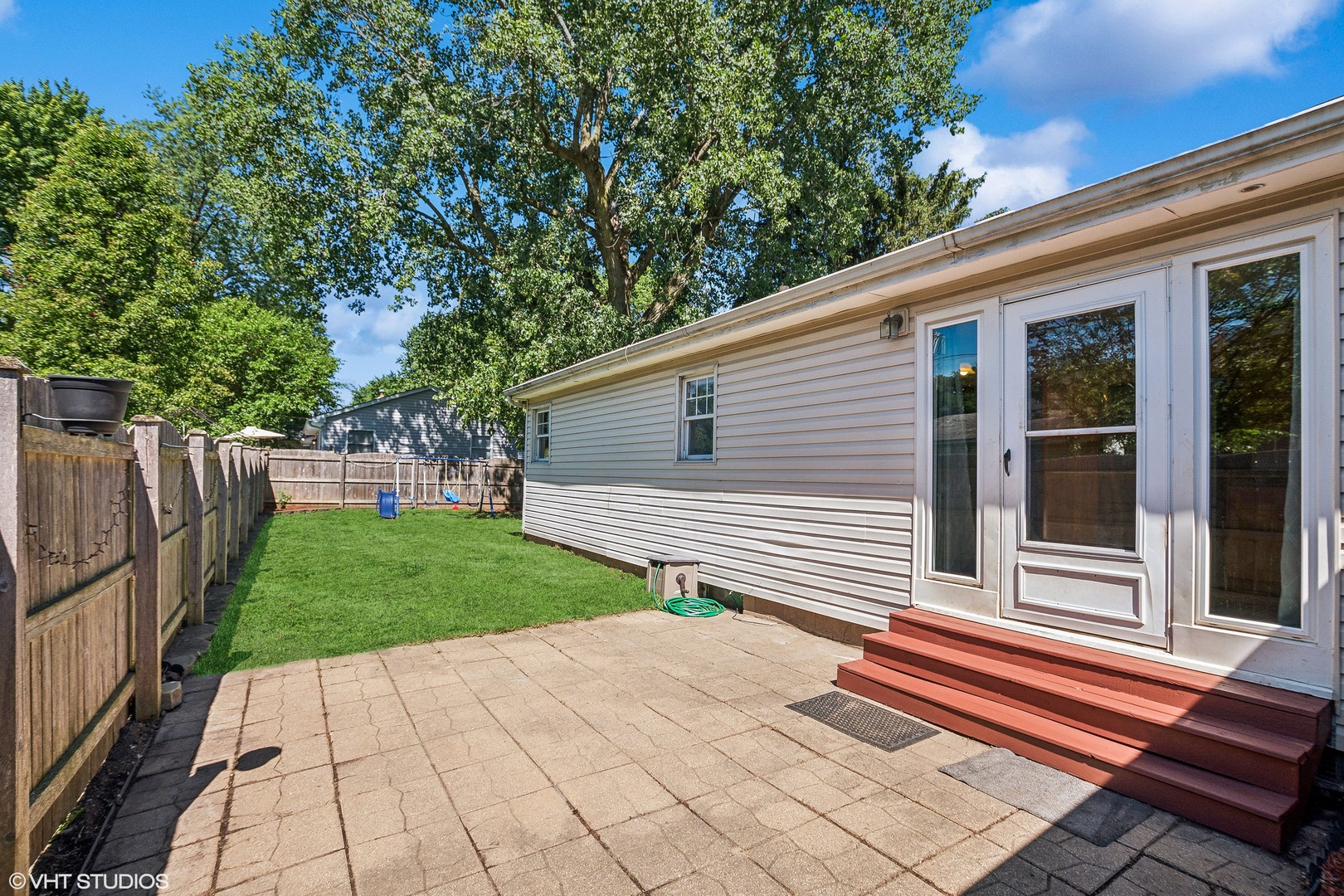 304 Hillside Road New Lenox, IL 60451 - Photo 13 of 16 a front view of a house with a yard