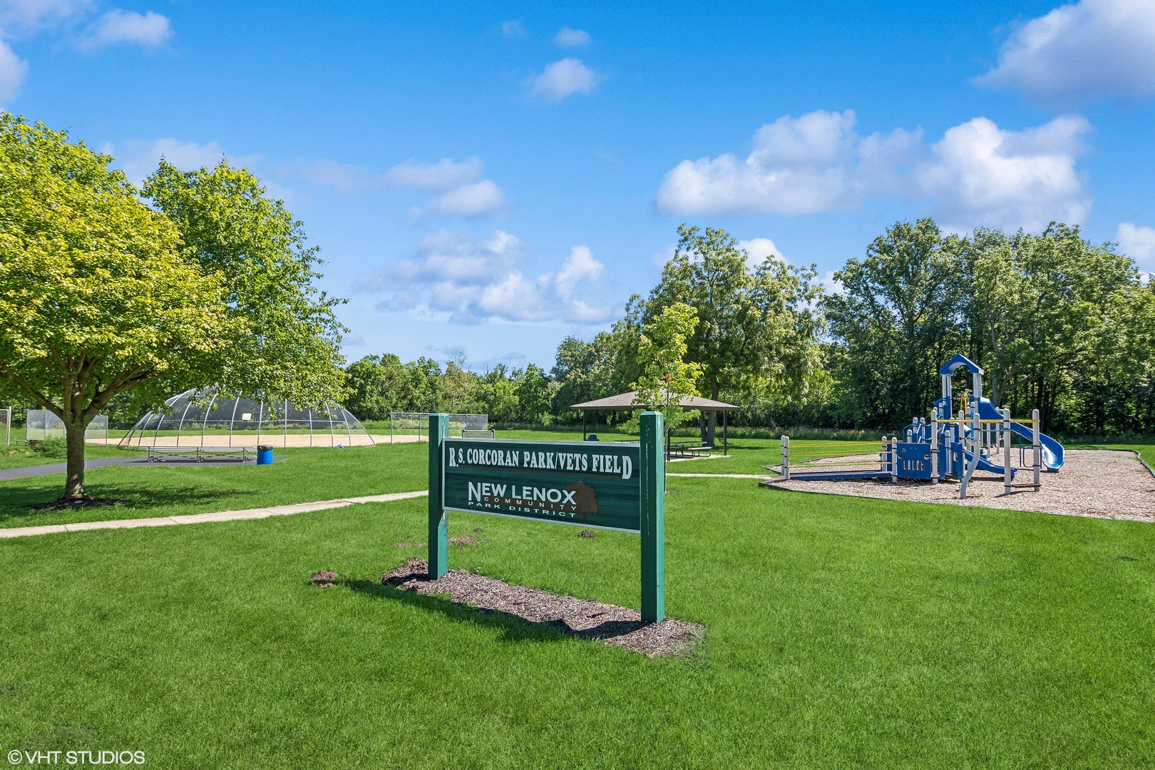 304 Hillside Road New Lenox, IL 60451 - Photo 16 of 16 a view of a park with swings and slides