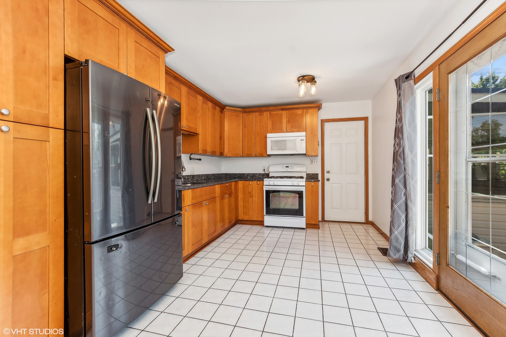 304 Hillside Road New Lenox, IL 60451 - Photo 5 of 16 a kitchen with stainless steel appliances a refrigerator sink and cabinets