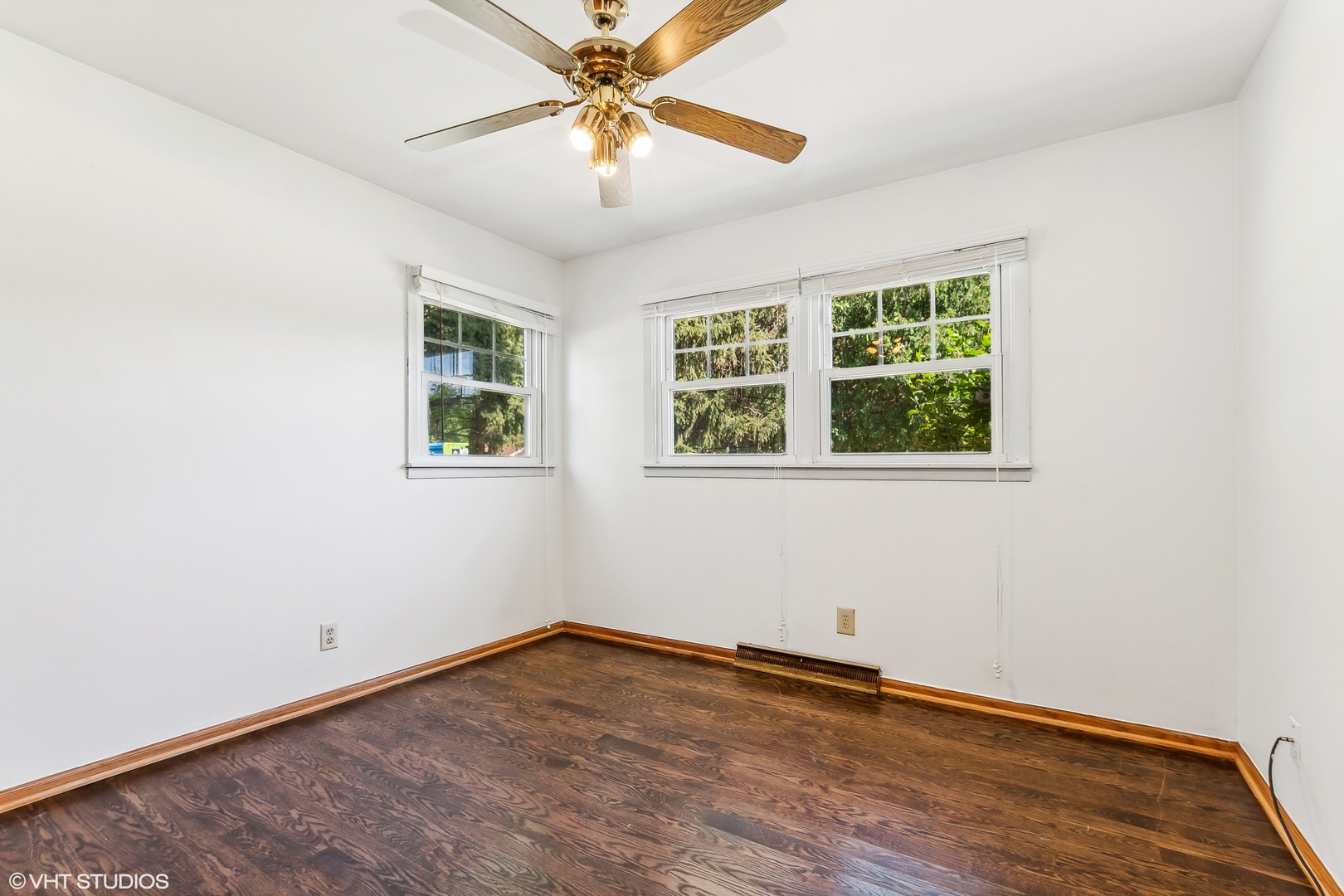 304 Hillside Road New Lenox, IL 60451 - Photo 7 of 16 an empty room with a window and a fan