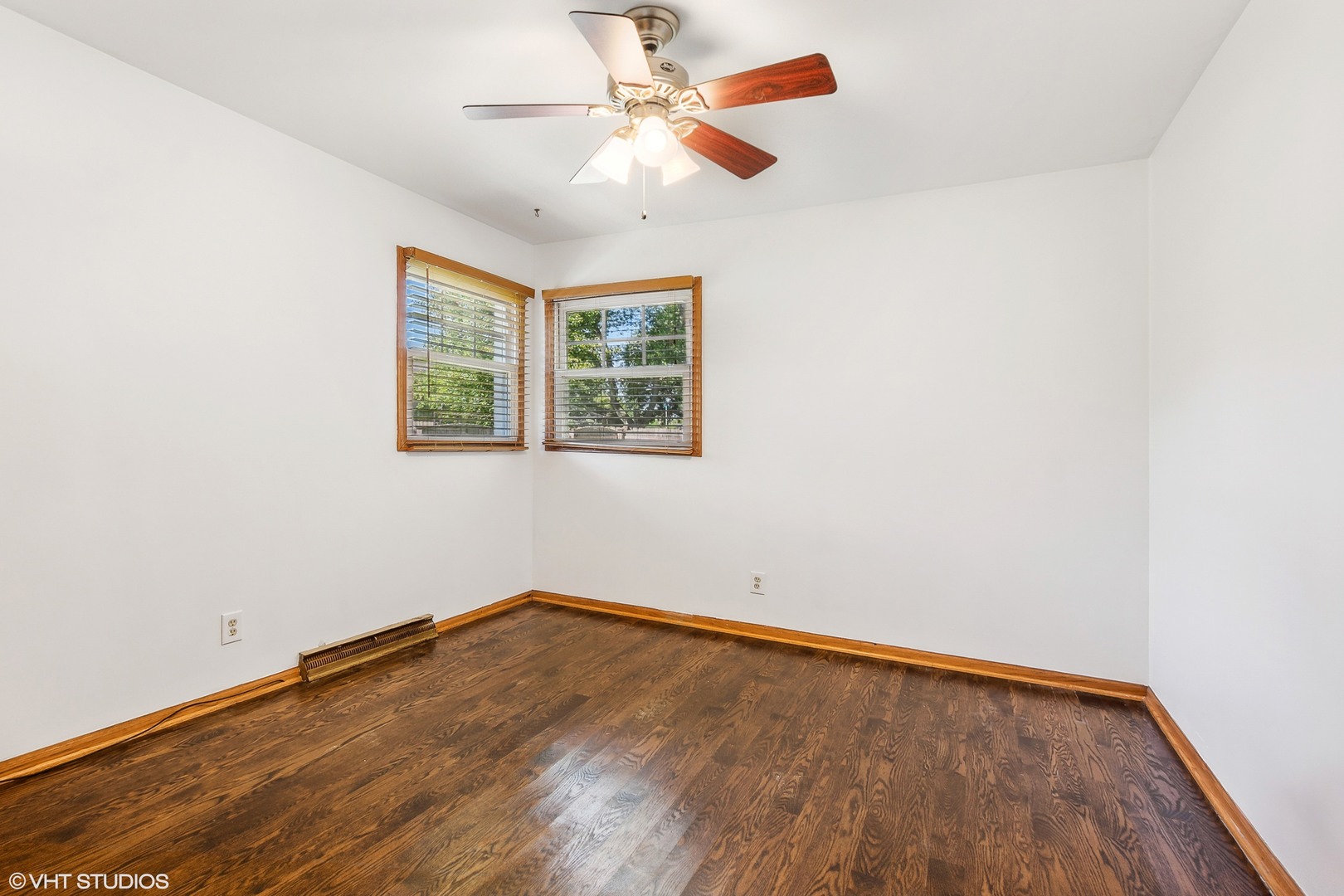 304 Hillside Road New Lenox, IL 60451 - Photo 8 of 16 an empty room with a window and a fan