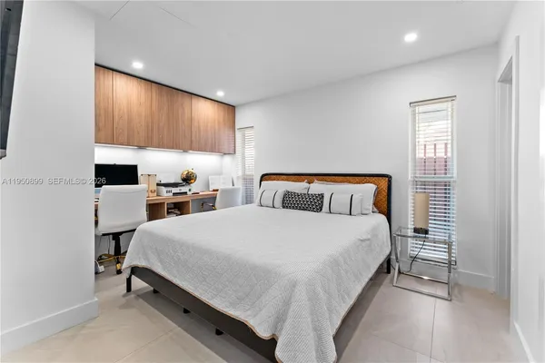 a bed room with a bed and window