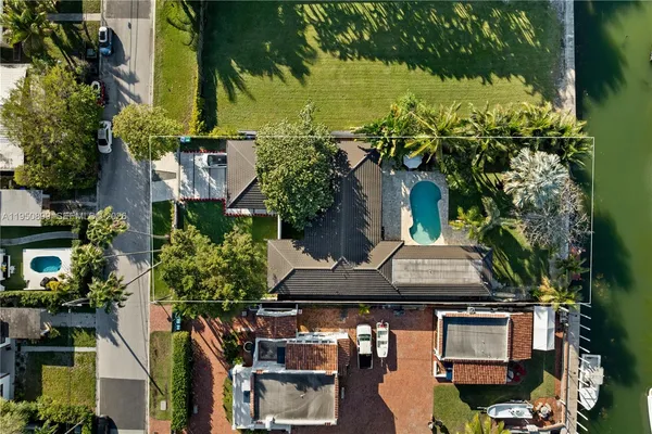 an aerial view of multiple houses with yard