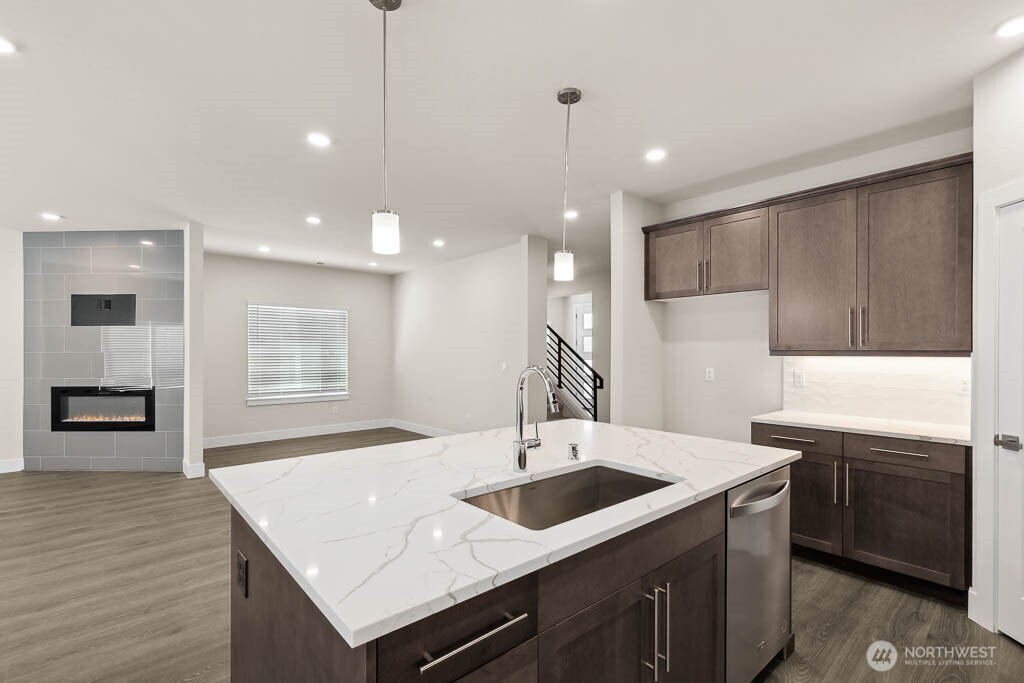 3819 194th Place Southeast Bothell, WA 98012 - Photo 13 of 33 a kitchen with stainless steel appliances kitchen island a sink a stove and a refrigerator