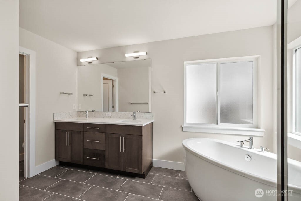 3819 194th Place Southeast Bothell, WA 98012 - Photo 21 of 33 a bathroom with a tub sink and mirror