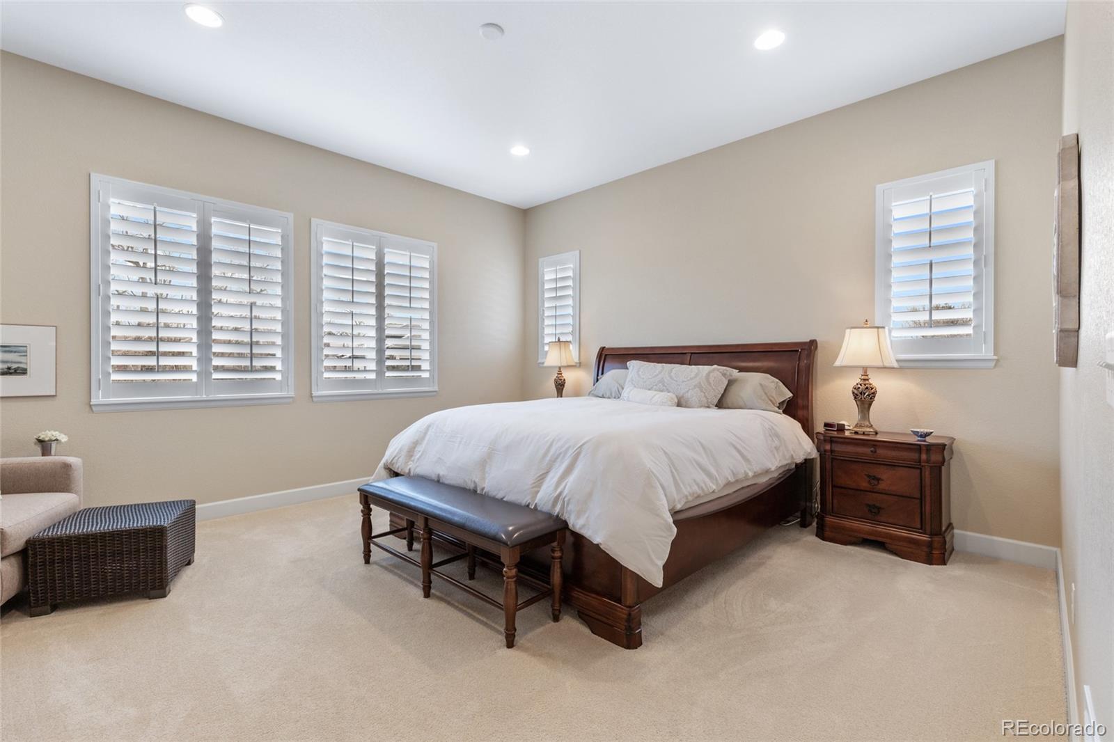49 Willowcroft Drive Littleton, CO 80123 - Photo 12 of 47 a spacious bedroom with a bed and a couch
