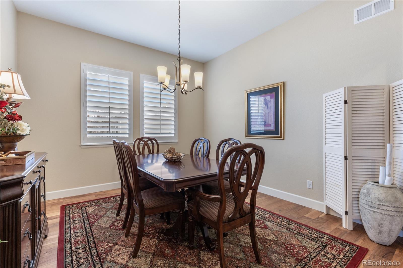 49 Willowcroft Drive Littleton, CO 80123 - Photo 23 of 47 a view of a dining room with furniture window and wooden floor