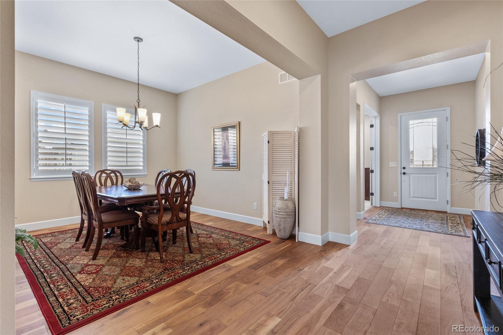 49 Willowcroft Drive Littleton, CO 80123 - Photo 24 of 47 a view of a dining room with furniture window and wooden floor