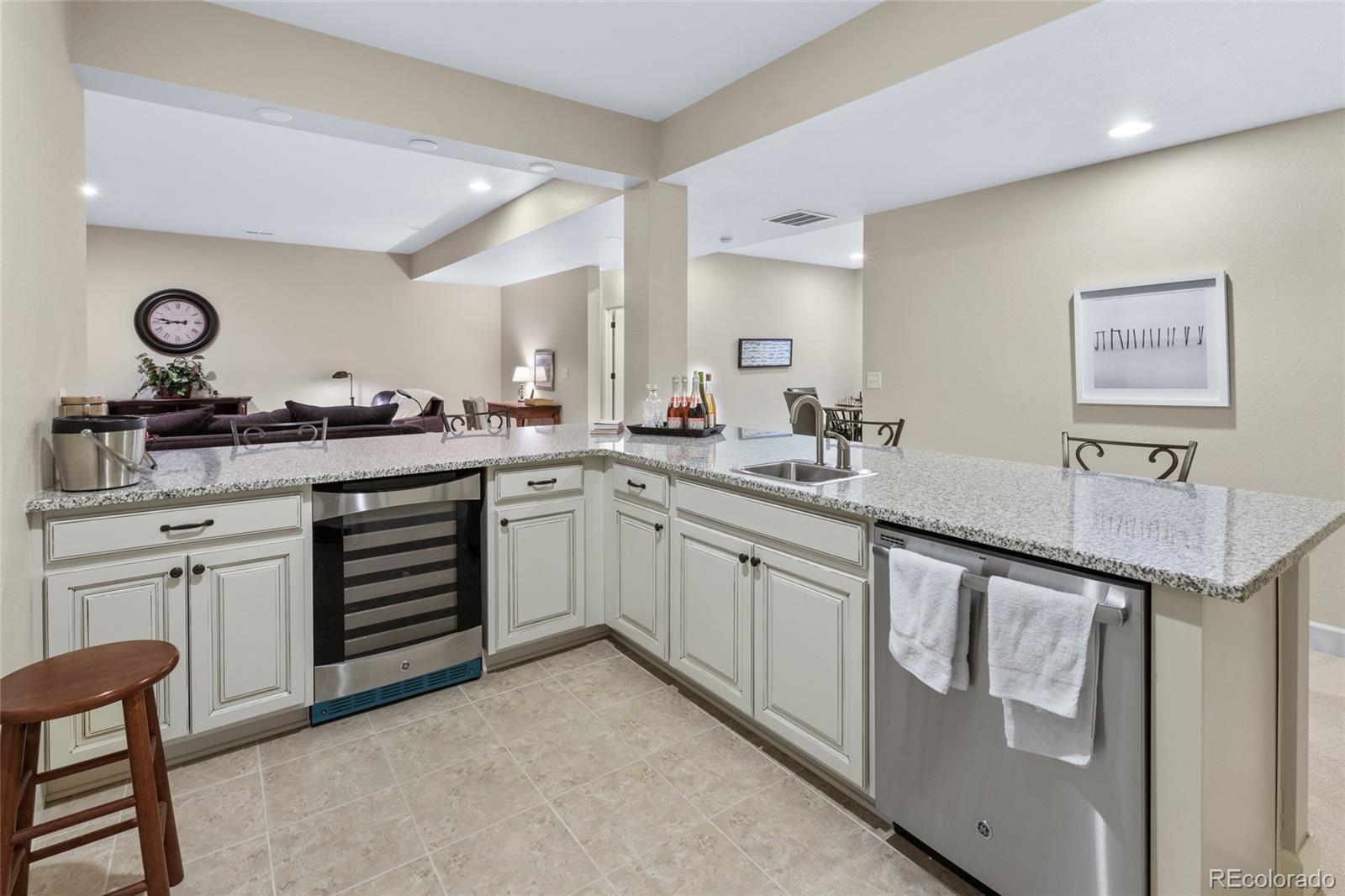 49 Willowcroft Drive Littleton, CO 80123 - Photo 34 of 47 a kitchen with a sink stove and cabinets