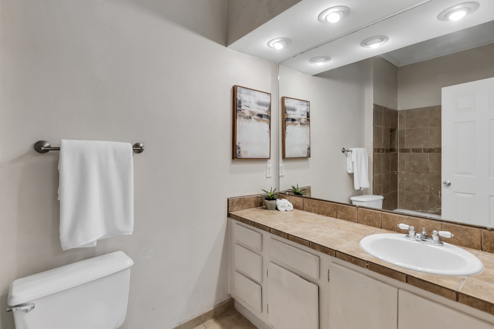 11970 Jollyville Road, Unit 104 Austin, TX 78759 - Photo 11 of 22 Bathroom featuring a vanity with a tiled countertop, an integrated sink, and recessed lighting
