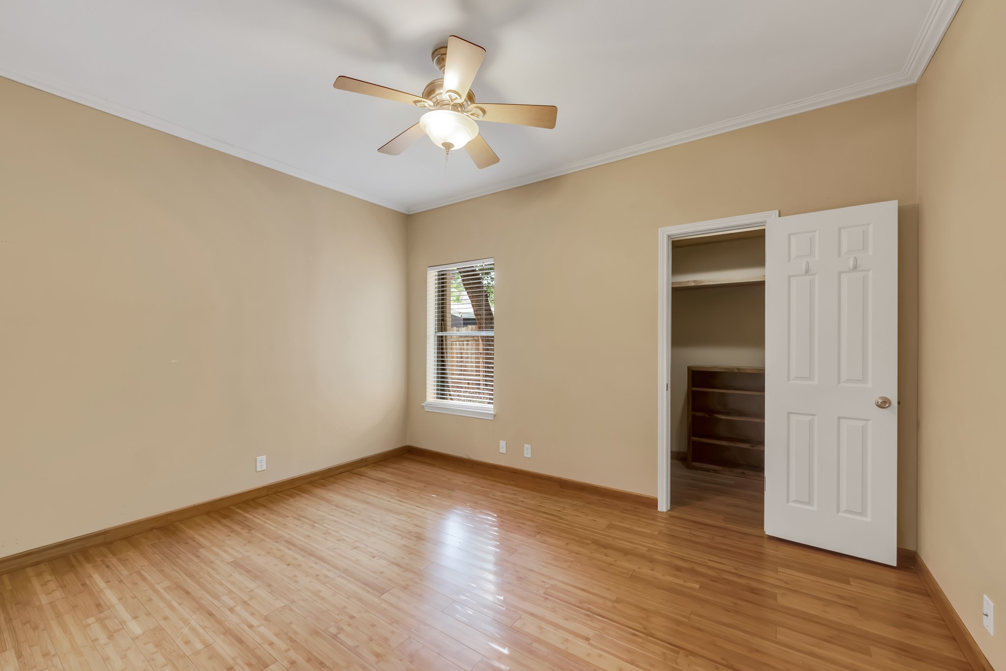 11970 Jollyville Road, Unit 104 Austin, TX 78759 - Photo 13 of 22 Bright interior space featuring hardwood floors and a ceiling fan
