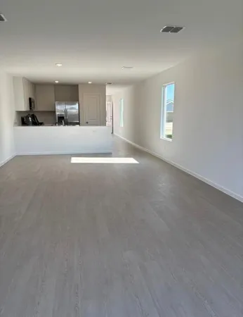 a view of a kitchen with a sink and a window