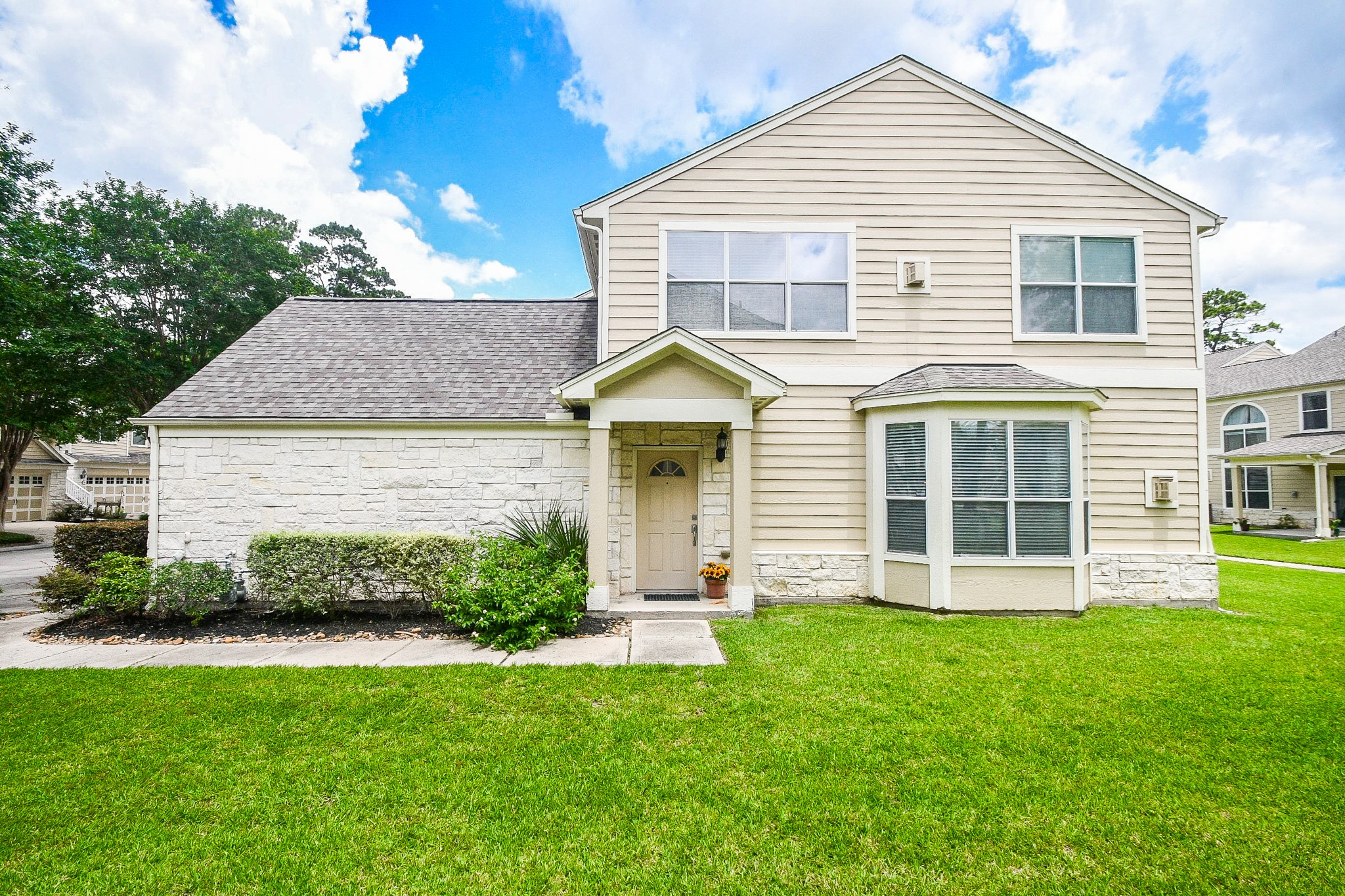 13600 Breton Ridge Street, Unit 36F Houston, TX 77070 - Photo 8 of 38 Welcoming approach with mature landscaping and a charming front entry.